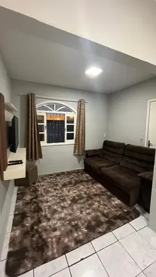Uma área de estar em Aluguel Casa no Centro Bombinhas