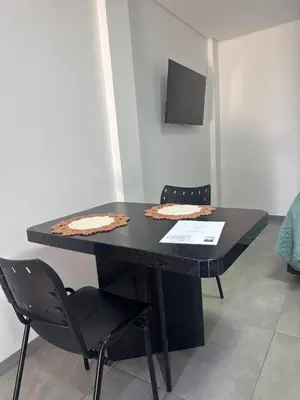 Uma televisão e/ou sistema de entretenimento em Casa , Studio Praia de Canto Grande