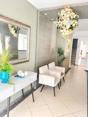 Uma área de estar em Apartamento BOMBINHAS a 120m do Mar - 10 pessoas