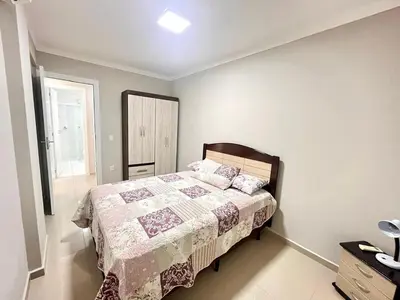 Uma cama ou camas num quarto em Apartamento BOMBINHAS a 120m do Mar - 10 pessoas