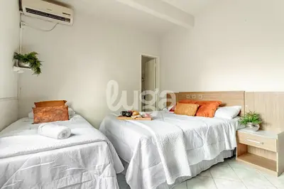 Uma cama ou camas num quarto em LUGA Casa Aconchegante a 800m da Praia de Palmas