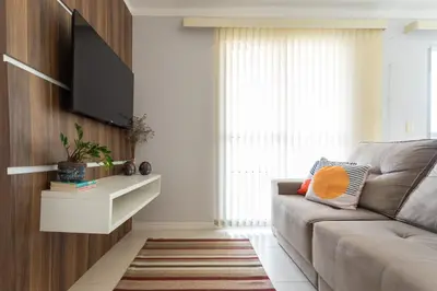 Uma televisão e/ou sistema de entretenimento em Praia, Churrasqueira e Hard Rock em Porto Belo