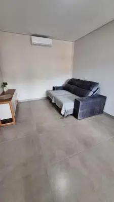 Uma área de estar em Residencial da Vila Apto 2