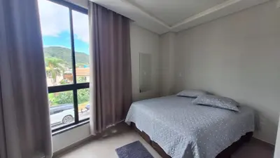Uma cama ou camas num quarto em Residencial da Vila Apto 2