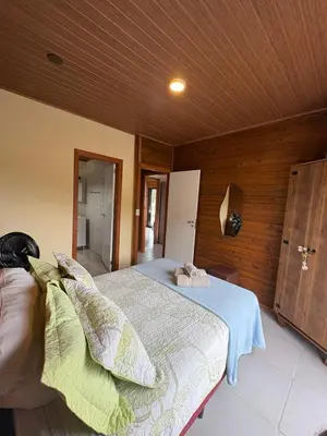 Uma cama ou camas num quarto em Cobertura Vista mar com churrasqueira