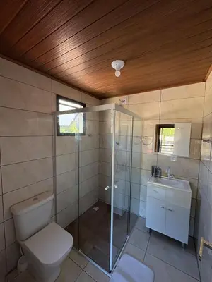 Uma casa de banho em Cobertura Vista mar com churrasqueira