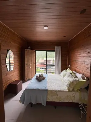Uma cama ou camas num quarto em Cobertura Vista mar com churrasqueira