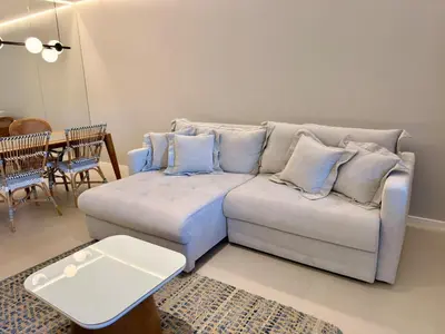 Uma área de estar em Frente Mar Panoramico 2 Suites Gourmet 2 vgs