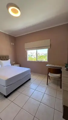 Uma cama ou camas num quarto em Apartamento na Praia de Palmas com vista para o mar, 250m da areia