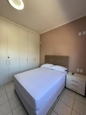 Uma cama ou camas num quarto em Apartamento na Praia de Palmas com vista para o mar, 250m da areia