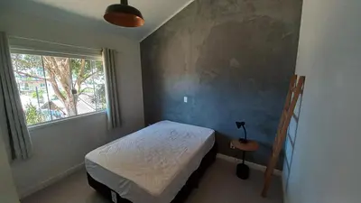 Uma cama ou camas num quarto em Casa 2 quartos próximo à praia em Itapema