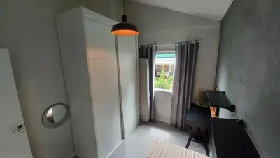 Uma cama ou camas num quarto em Casa 2 quartos próximo à praia em Itapema