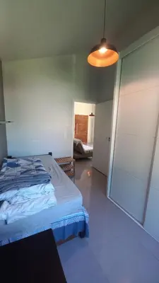 Uma cama ou camas num quarto em Casa 2 quartos próximo à praia em Itapema