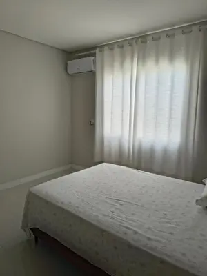 Uma cama ou camas num quarto em Jardim dourado
