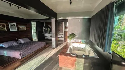 Uma cama ou camas num quarto em Casa nas Nuvens com incrível vista mar