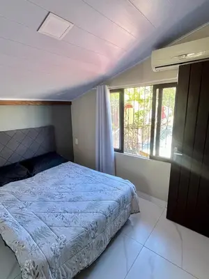 Uma cama ou camas num quarto em Casa de praia a 200 metros do mar