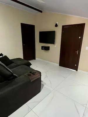 Uma televisão e/ou sistema de entretenimento em Casa de praia a 200 metros do mar