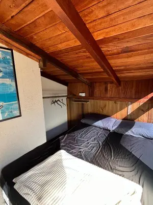 Uma cama ou camas num quarto em Casa de praia a 200 metros do mar