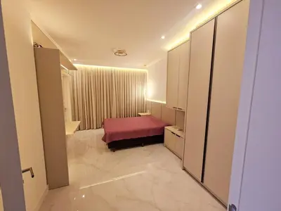 Uma cama ou camas num quarto em Lindo Apto novo 3 suítes no coração de Meia Praia