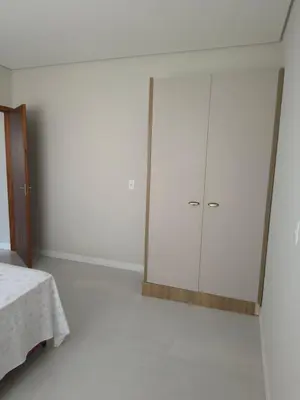 Uma cama ou camas num quarto em Jardim dourado