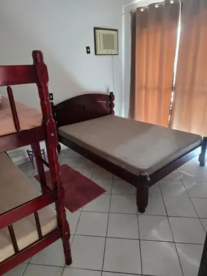 Uma cama ou camas num quarto em Aluguel em Itapema 2
