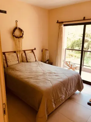 Uma cama ou camas num quarto em Casa da Débora