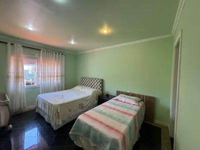 Uma cama ou camas num quarto em Casa Alameda das Laranjeiras