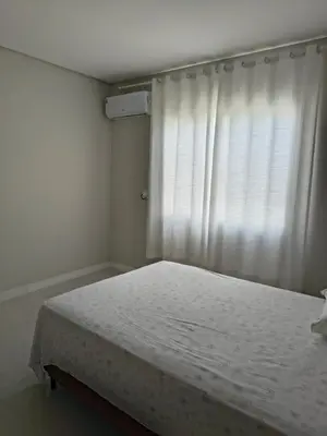 Uma cama ou camas num quarto em Jardim dourado