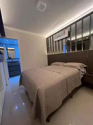 Uma cama ou camas num quarto em Seu refúgio em Bombinhas, conforto e pé na areia