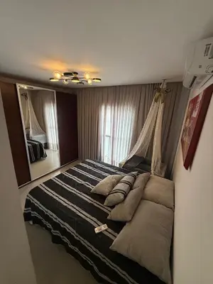 Uma cama ou camas num quarto em Duplex de veraneio , Temporada