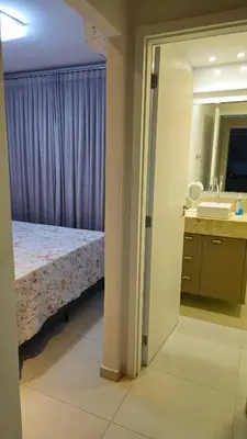 Uma cama ou camas num quarto em Novo apartamento em Itapema - 02 suites
