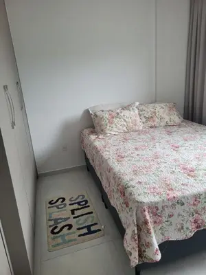 Uma cama ou camas num quarto em Novo apartamento em Itapema - 02 suites