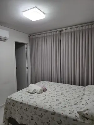 Uma cama ou camas num quarto em Novo apartamento em Itapema - 02 suites