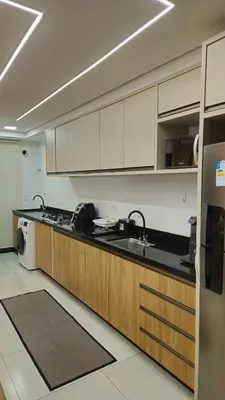 A cozinha ou kitchenette de Novo apartamento em Itapema - 02 suites