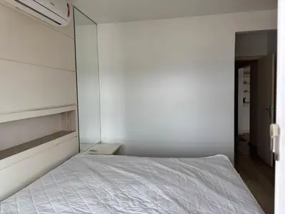 Uma cama ou camas num quarto em Vista para o molhe