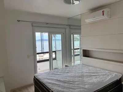 Uma cama ou camas num quarto em Vista para o molhe