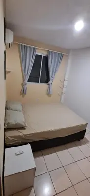 Uma cama ou camas num quarto em Na quadra do mar - apartamento com 3 dormitórios