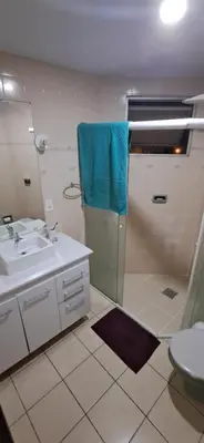 Uma casa de banho em Na quadra do mar - apartamento com 3 dormitórios