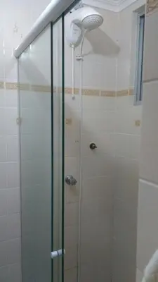 Uma casa de banho em Na quadra do mar - apartamento com 3 dormitórios