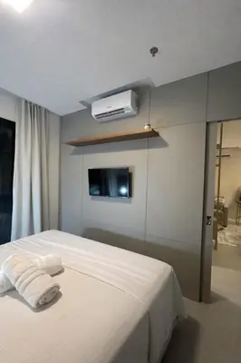 Uma cama ou camas num quarto em Flat novo próximo ao Hard Rock