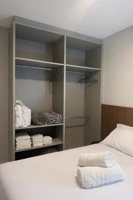 Uma cama ou camas num quarto em Flat novo próximo ao Hard Rock