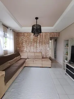 Uma área de estar em Casa Fernandes