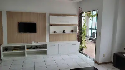 Uma televisão e/ou sistema de entretenimento em Cobertura -Itapema