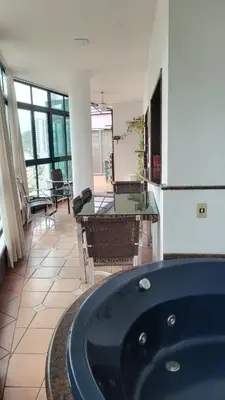 Uma área de estar em Cobertura -Itapema