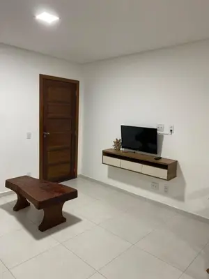 Uma televisão e/ou sistema de entretenimento em Casa de temporada Bombinhas