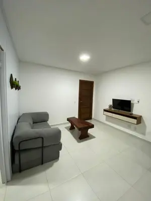 Uma televisão e/ou sistema de entretenimento em Casa de temporada Bombinhas
