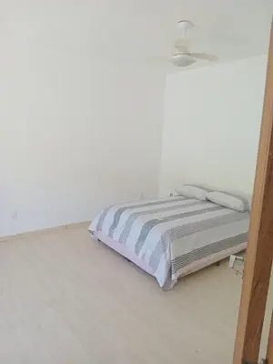 Uma cama ou camas num quarto em Casa inteira em Itapema Conforto, Wi-Fi e Tranquilidade