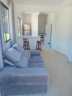 Uma área de estar em Casa inteira em Itapema Conforto, Wi-Fi e Tranquilidade