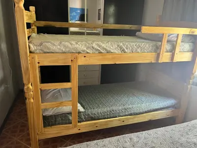 Uma ou mais camas em beliche num quarto em Casa Vidro Mar