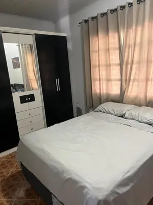 Uma cama ou camas num quarto em Casa Vidro Mar